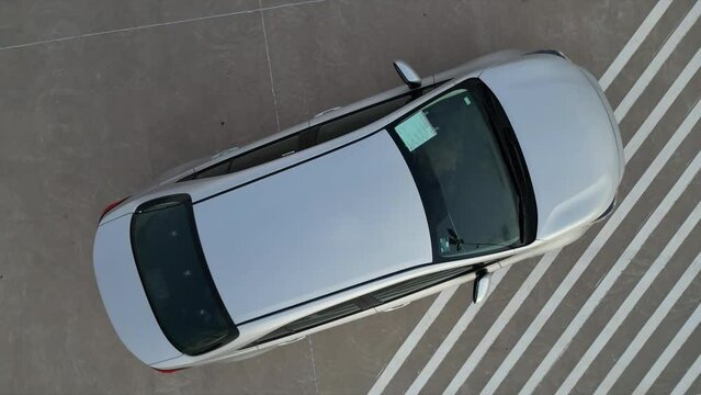 upward view of a car in parking lot with a drone, aerial view