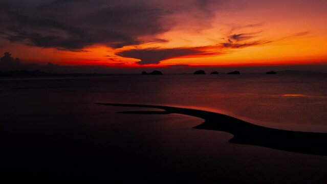 Flaming orange sunset at exotic foreland