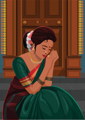 Indian woman sitting by a door