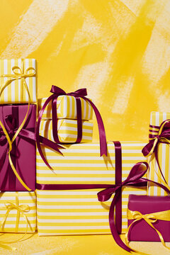 pile of gifts with stripes and ribbons