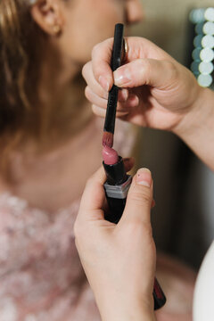 Close-up of a brush and lipstick.