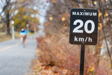 Speed limit sign, 20 kilometers per hour for bicycle lane in park