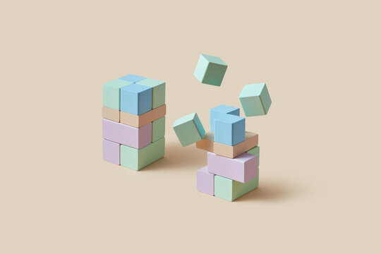 Whole and destroyed towers made of colorful wooden blocks in studio