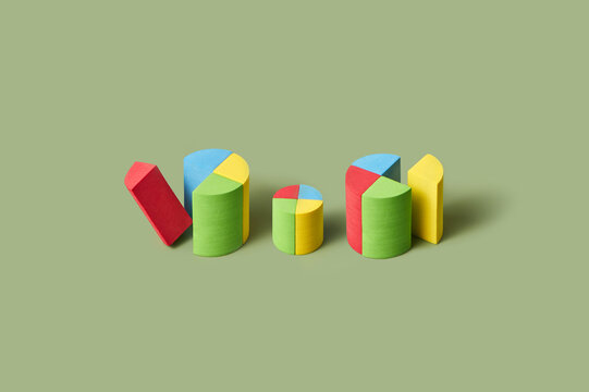 Colorful wooden bricks forming geometric cylinders in studio
