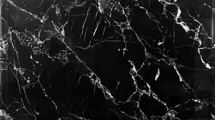 A luxurious, dark black marble background with a glossy finish, accentuated by subtle white and grey veining, perfect for creating a sophisticated and chic wallpaper or tile skin.