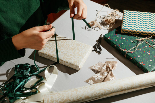 Anonymous Woman Wrapping Present.