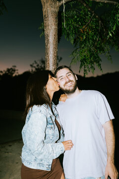 Woman Liking Her Boyfriends Face