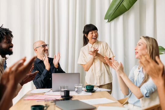 Colleagues celebrating success in office