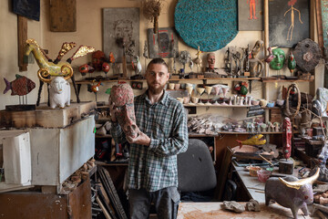 man with mask sculpture