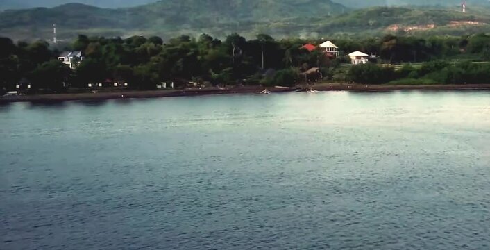 aerial video of a freshwater lake with villas and beautiful views around it