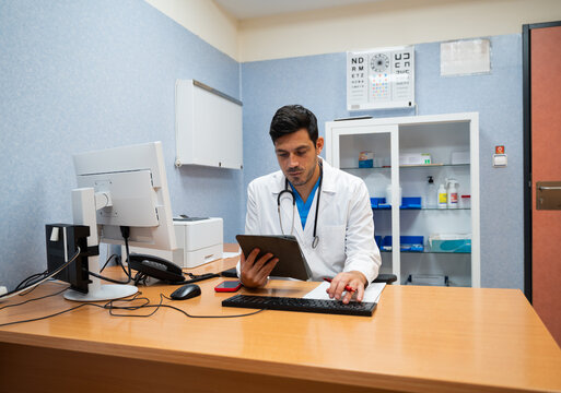 doctor using a tablet computer in a medical office