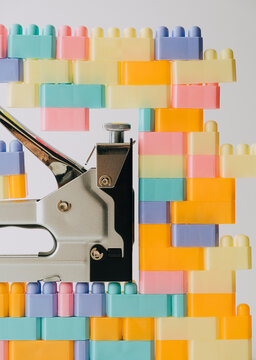 Staple gun and toy bricks