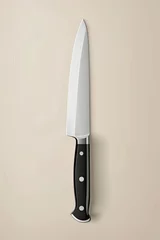 Fotobehang Elegant Chef's Knife on neutral background. © David Zarzosa