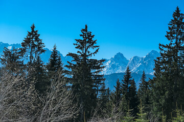 Scenic view of snowcapped mountain peaks of Julian Alps seen from Dreilaendereck, Karawanks, Carinthia, Austria. Hiking in remote alpine landscape in early springtime in Austrian Alps. Wanderlust