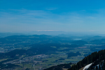 Panoramic view from Dreilaendereck on Rosental valley in Carinthia, Austria. Borders between Austria, Slovenia, Italy. Looking at alpine landscape of hills, lakes and forest. Hiking in early spring