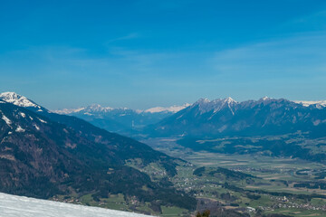 Panoramic view of Gailtal valley surrounded by Gailtal Alps and High Tauern. Looking from Dreilaendereck, Carinthia, Austria. Borders between Austria, Slovenia, Italy. Looking at alpine landscape