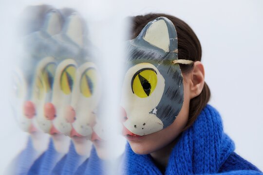 Person hide identity behind mask