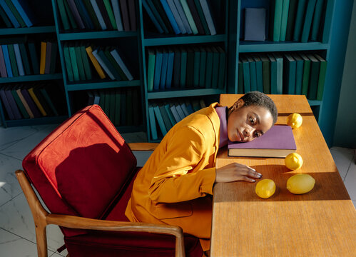 Contemplative reader in vibrant study