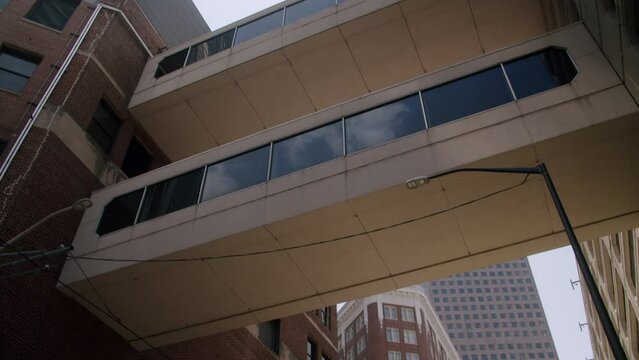 Low angle of skybridge connects the garage with neighboring buildings at the daytime in Atlanta