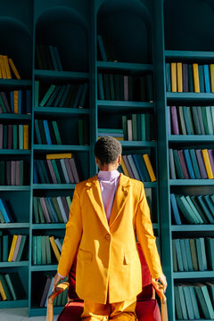 Back view of person in jacket put on backwards 
