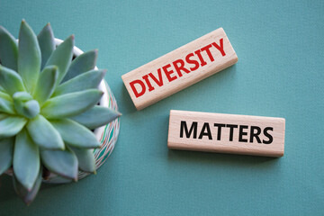 Diversity matters symbol. Wooden blocks with words Diversity matters. Beautiful grey green...