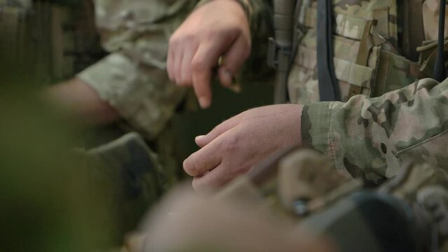 Ukrainian soldiers in process of loading magazines 