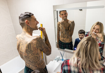 a family brushing their teeth