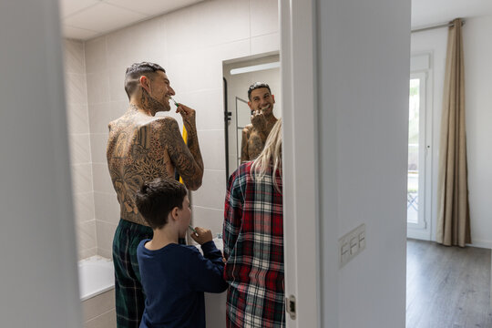 a family brushing their teeth