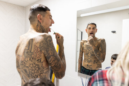 a family brushing their teeth