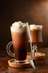 Creamy milk chocolate drinks with whipped cream.