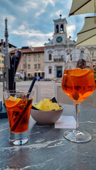 Typical Italian alcoholic aperitif (aperitivo) served in bar on Piazza Matteotti, Udine, Friuli...