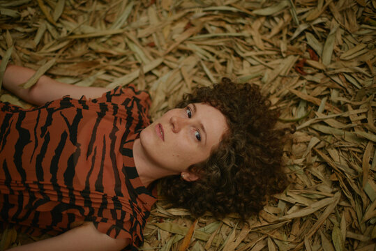 a woman lying on a ground