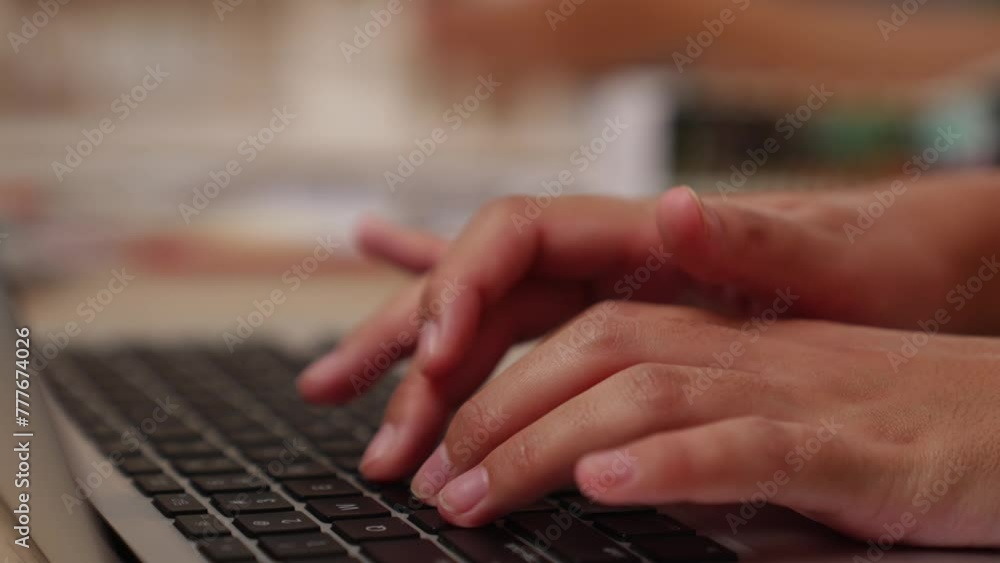 Poster closeup hand using laptop on workspace table on blurred background of colleagues or coworker working