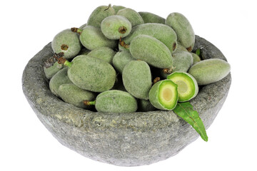 green almonds (cagla badem) from Turkey in a stone bowl isolated on white background