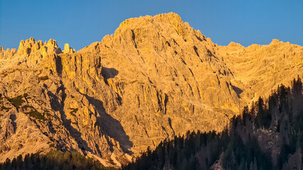 Scenic sunrise view of majestic mountain peak of Dreischusterspitze in untamed Sexten Dolomites, South Tyrol, Italy, Europe. Hiking in panoramic Fischleintal (Val Fiscalina), Italian Alps. Wanderlust - obrazy, fototapety, plakaty