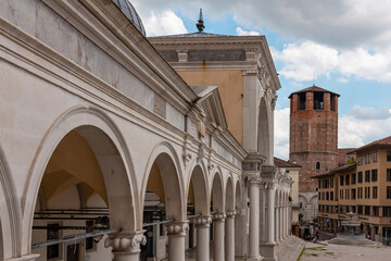 Columns under Venetian style clock tower Torre dell'Orologio on main square Piazza della Liberta in...