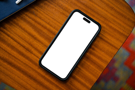 Mobile with white screen on the table