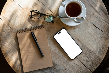 Mobile phone with white screen on the table