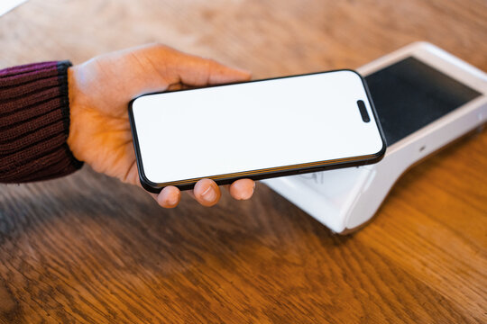 Payment by mobile phone using the terminal