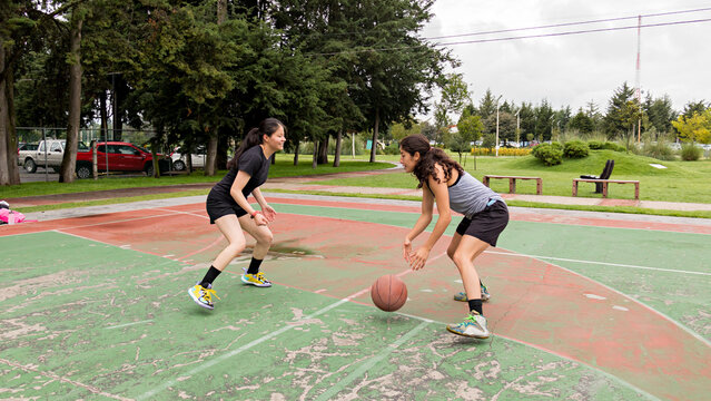 Female basketball enthusiasts engage in a practice session