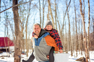 family close to a maple shack having fun together