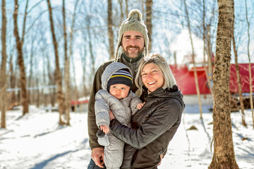 family close to a maple shack having fun together - 777685817