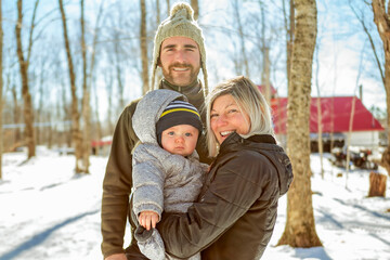 family close to a maple shack having fun together - 777685830