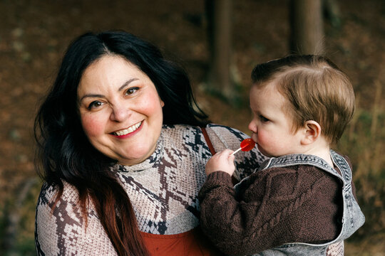 portrait of smiling mother and her toddler son