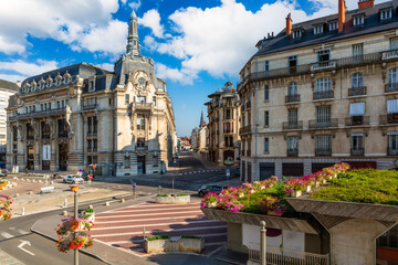 Place Grangier and Temple street in Dijon with the Poste building. Dijon is a city that serves as the prefecture of the Cote-d'Or department. - 777689052