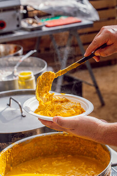 Serving Aji de gallina on a food festival