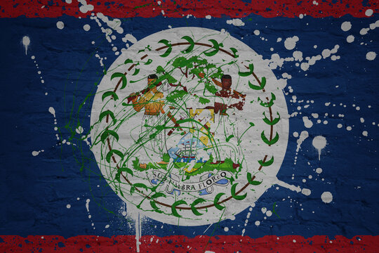 painted big national flag of belize on a massive old brick wall