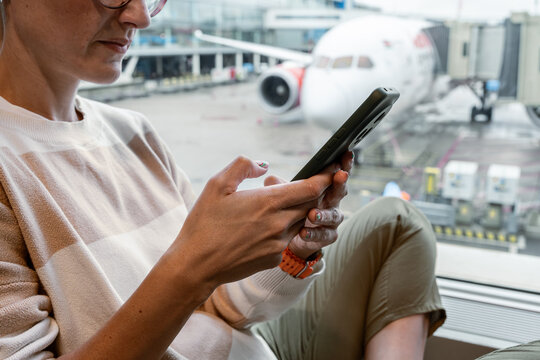 Traveler using mobile phone.