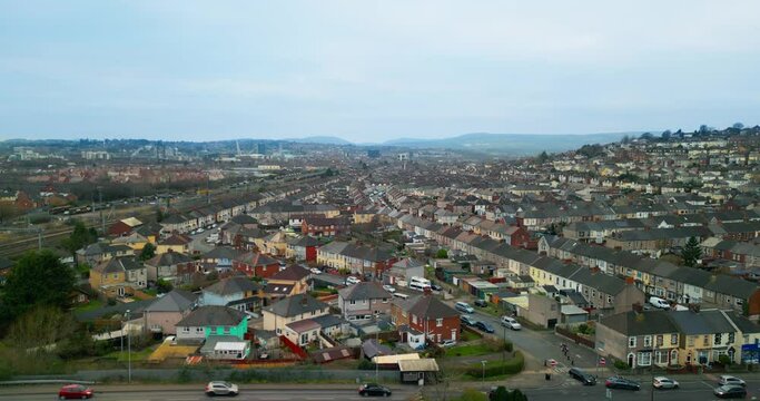 City of Newport in Wales UK | Panoramic view of residential neighborhoods | Frame captured from the perspective of Somerton district | in the background city center visible | drone footage 