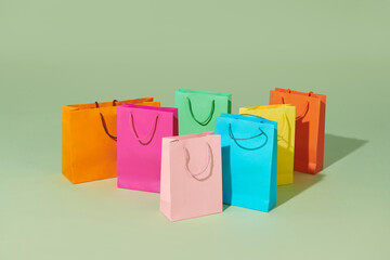 Many colorful paper bags with goods. Shopping or sale concept